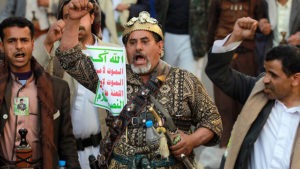 Cartello con lo slogan del movimento Houthi